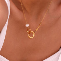 Double loop pearl necklace worn on neckline