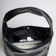 Reinforced handle detail on leather bucket bag