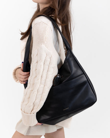 The Maya hobo bag in black leather, front view