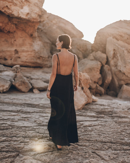 Low back detail on black slip maxi dress